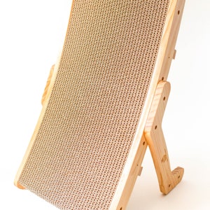 Wooden cat scratcher standing upright on a white background