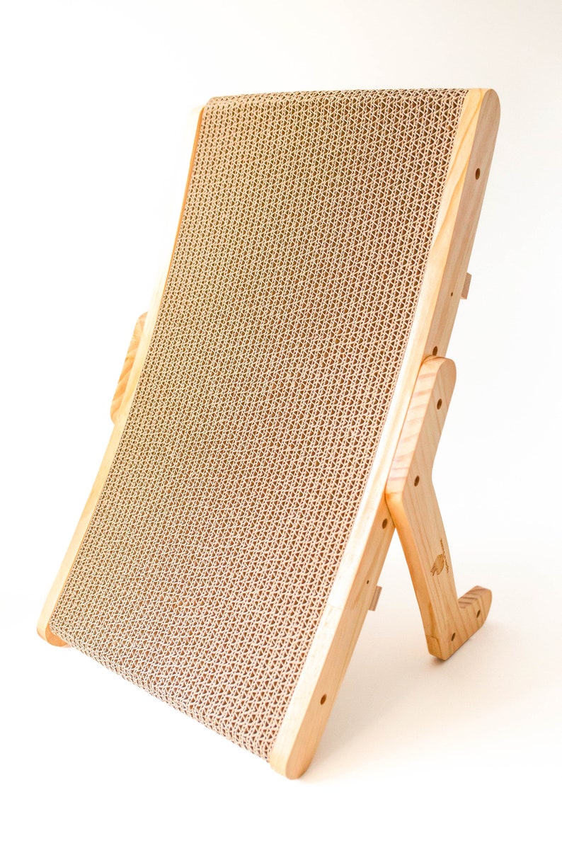 Wooden cat scratcher standing upright on a white background