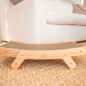 Wooden cat scratcher laying flat in a living room