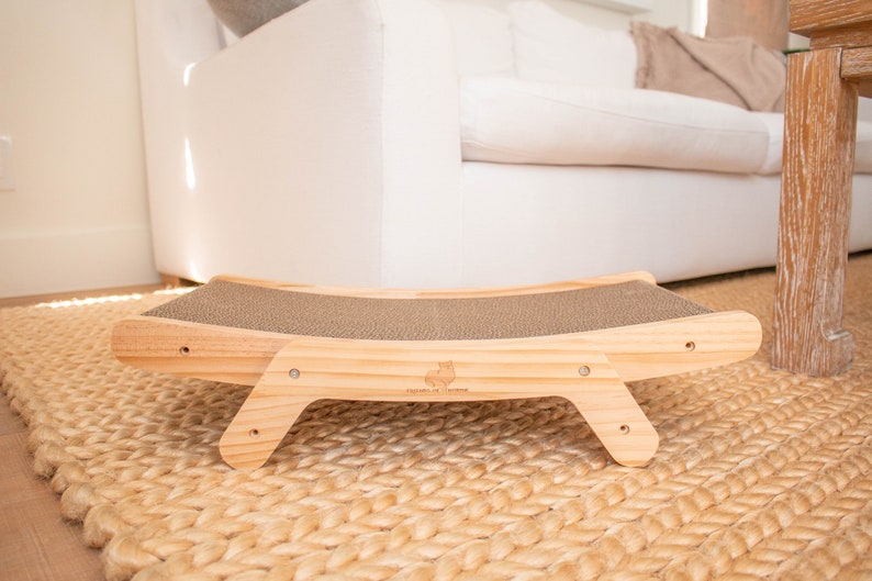 Wooden cat scratcher laying flat in a living room