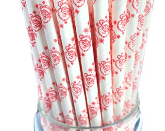 May include: A bundle of white paper straws with a red Santa Claus and snowflake pattern. The straws are arranged in a clear glass, perfect for holiday beverages. The festive design adds a touch of Christmas cheer to any drink.