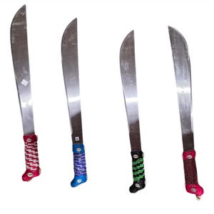 May include: Four machetes with curved stainless steel blades. The handles are decorated with colourful beadwork in red, blue, green, and brown, each with a decorative shell accent. The blades are silver and the handles are wrapped in intricate patterns.