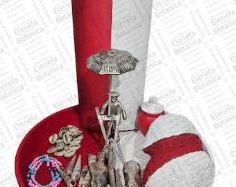 May include: A red and white tray with a silver decorative stand with an umbrella, a pair of silver tongs, a red and white towel, seashells, and a blue and pink beaded necklace.