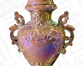 May include: A gold ceramic vase with ornate details and a lid. The vase has a pearlescent finish and a heart-shaped body.