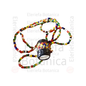 May include: A colorful beaded necklace with a black and white pendant. The pendant is decorated with small, colorful beads and has a white shell on the bottom.