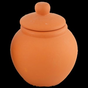 May include: A terracotta jar with a lid. The jar is a light orange color and has a smooth, rounded shape.