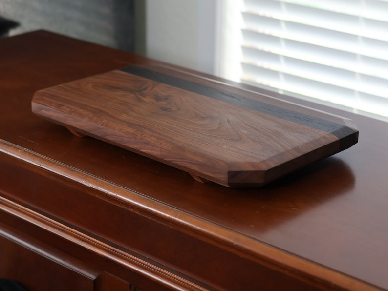 highly figured walnut cutting board with wooden feet image 5