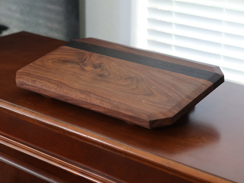 highly figured walnut cutting board with wooden feet image 4