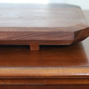 highly figured walnut cutting board with wooden feet image 7