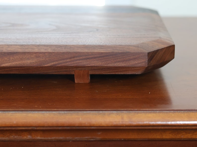 highly figured walnut cutting board with wooden feet image 7