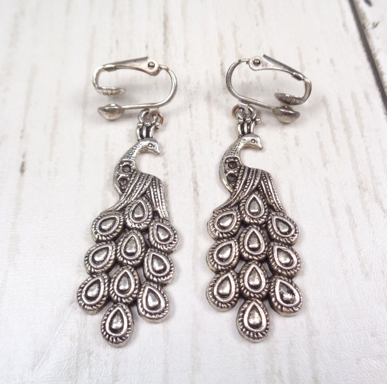 Elegant Silver-tone Clip On Peacock Earrings image 1