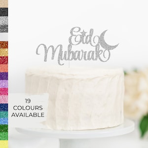 May include: Silver glitter cake topper with the words "Eid Mubarak" and a crescent moon and star. 19 colors available.