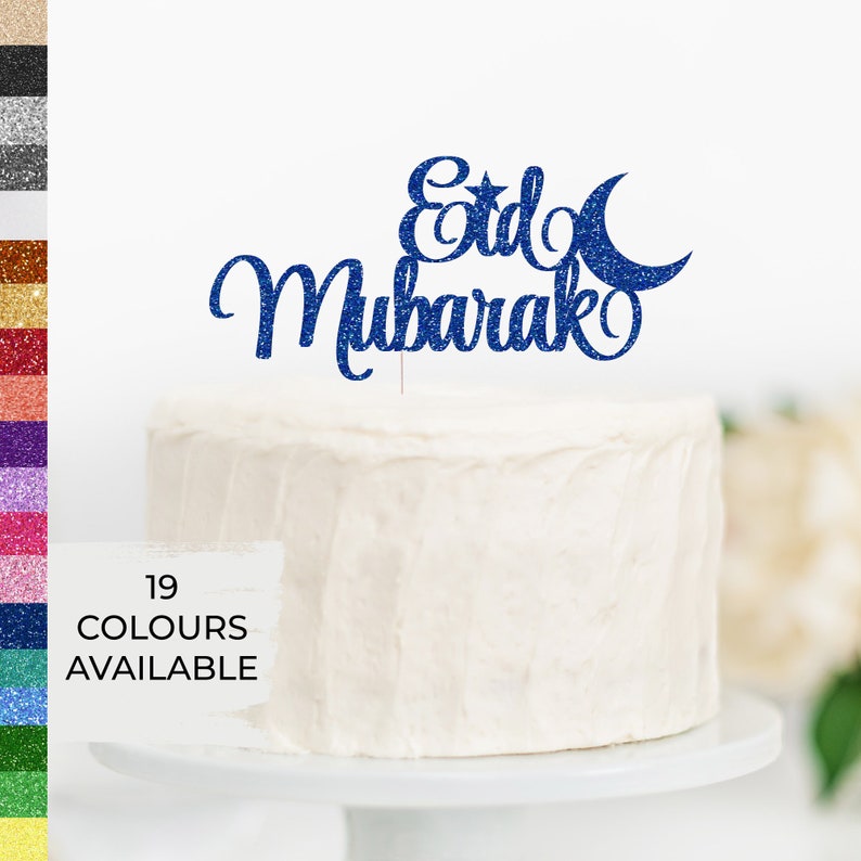 May include: Blue glitter cake topper with the words "Eid Mubarak" and a crescent moon and star.