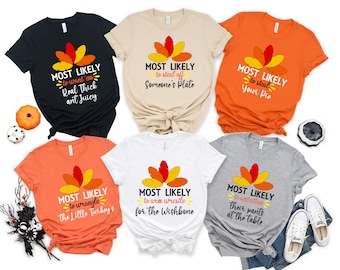 May include: Six orange, white, black, and gray t-shirts with a Thanksgiving turkey design and funny sayings. The shirts say "Most Likely to..." and include phrases like "want 'em real thick and juicy", "steal off someone's plate", "steal your pie", "wrangle the little turkey's", "arm wrestle for the wishbone", and "unbutton their pants at the table".