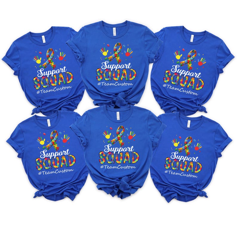 May include: Six royal blue t-shirts with a white graphic of a puzzle piece ribbon with colorful puzzle pieces and the text "Support Squad #TeamCustom".
