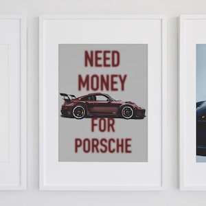 May include: Three framed prints, each featuring a different image of a Porsche sports car. The center print has a red Porsche with the text "NEED MONEY FOR PORSCHE" in red.