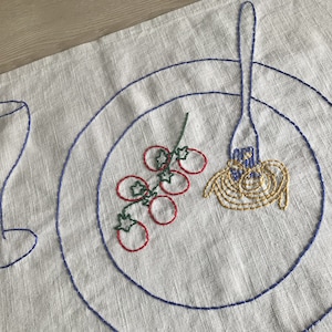 Hand-embroidered linen placemat for pasta lovers featuring a plate with tomatoes and spaghetti,glass and fork.Pasta party.Gift Italian style