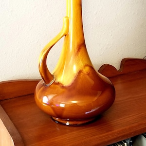 Stor guldfärgad droppkanna