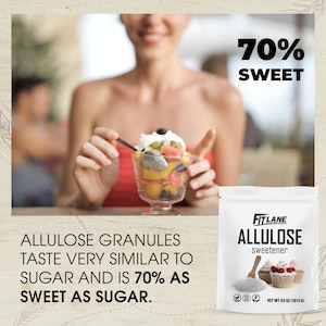 May include: A white bag of FitLane Allulose sweetener granules. The bag has a picture of cupcakes and the text "70% Sweet" is in the upper right corner of the image. The text "Allulose Sweetener" is on the bag. The bag is on a wooden surface. The text "Allulose Granules Taste Very Similar To Sugar And Is 70% As Sweet As Sugar." is below the bag.