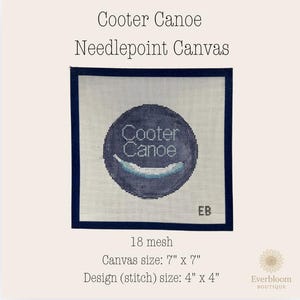 May include: A square needlepoint canvas featuring a dark blue circular design with the text Cooter Canoe and a light blue curved shape. The canvas has a dark blue border, 18 mesh, a 7 inch by 7 inch total size, and a 4 inch by 4 inch design area.