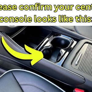 May include: Interior car detail showing the center console with cup holders and a storage compartment. The text at the top says, "Please confirm your center console looks like this:" A yellow arrow points to the console.