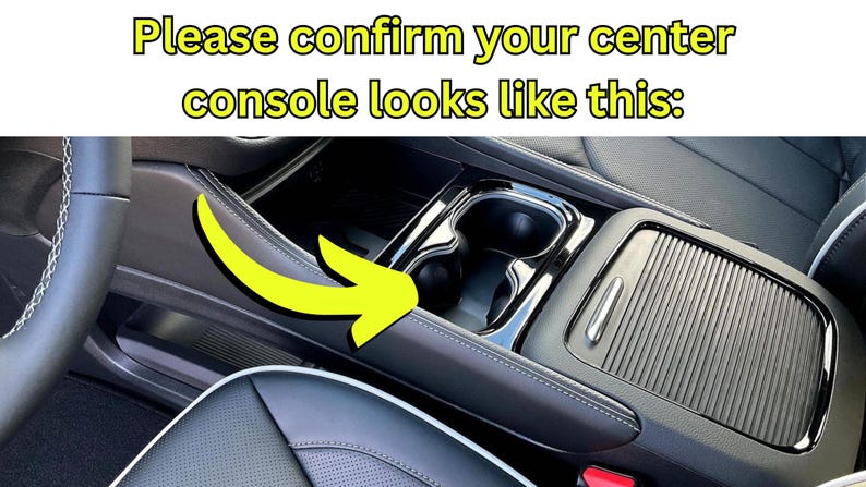 May include: Interior car detail showing the center console with cup holders and a storage compartment. The text at the top says, "Please confirm your center console looks like this:" A yellow arrow points to the console.