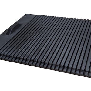 May include: Black plastic grill grate with a handle. The grate is made of thin, parallel slats.