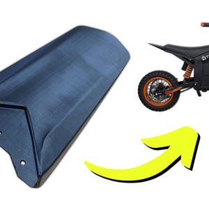 May include: A dark blue motorcycle fender and an orange and black electric motorcycle. The motorcycle has orange wheels and suspension. The fender is angled and has three holes.