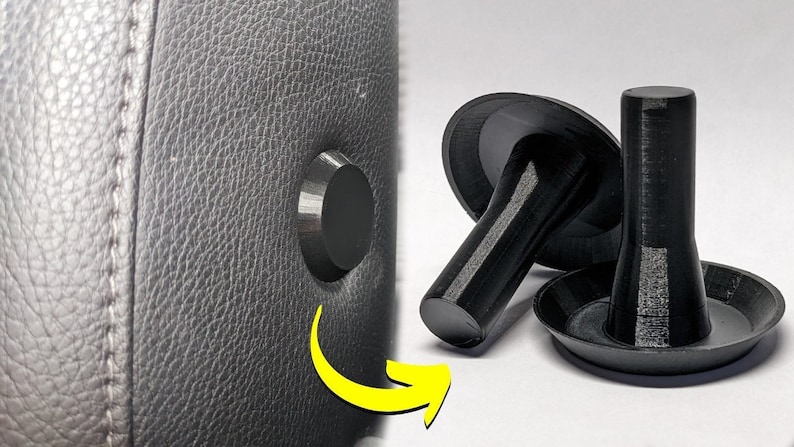 Op de afbeelding: Twee zwarte plastic meubelfoten met een paddenstoelvormige basis en een cilindrische steel. De voeten zijn ontworpen om gebroken of ontbrekende meubelfoten te vervangen.