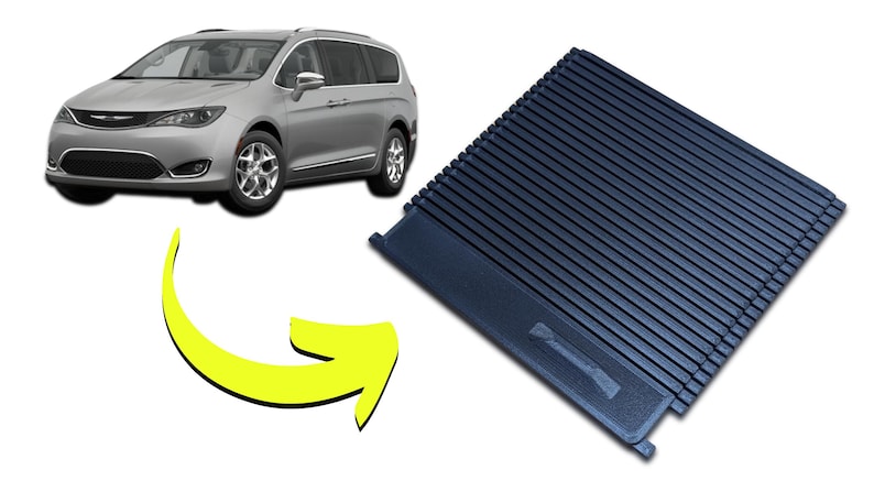 May include: A silver minivan with a black interior panel. The panel is dark blue and has a ridged design. The image includes a yellow arrow pointing from the car to the panel.