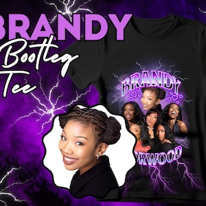 May include: Black t-shirt with a graphic print of Brandy Norwood and the text "BRANDY" in a purple and white lightning bolt design. The graphic also includes hearts and the text "NORWOOD".