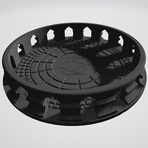 May include: A black circular arena with a textured floor and a raised outer wall with arches. The arena is designed for tabletop gaming.