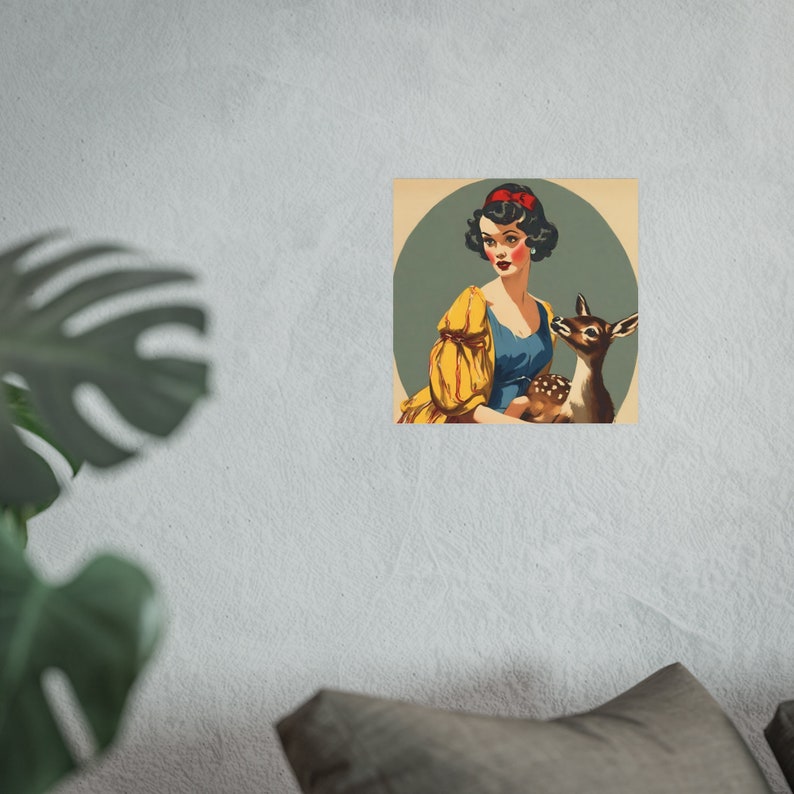 vintage Snow White poster hanging on a wall next to a houseplant