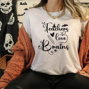 Teachers Love Brains Halloween T-Shirt: Spooky Teacher Graphic Tee