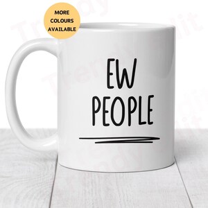 May include: White ceramic coffee mug with black text that reads "EW PEOPLE" with a black line underneath.