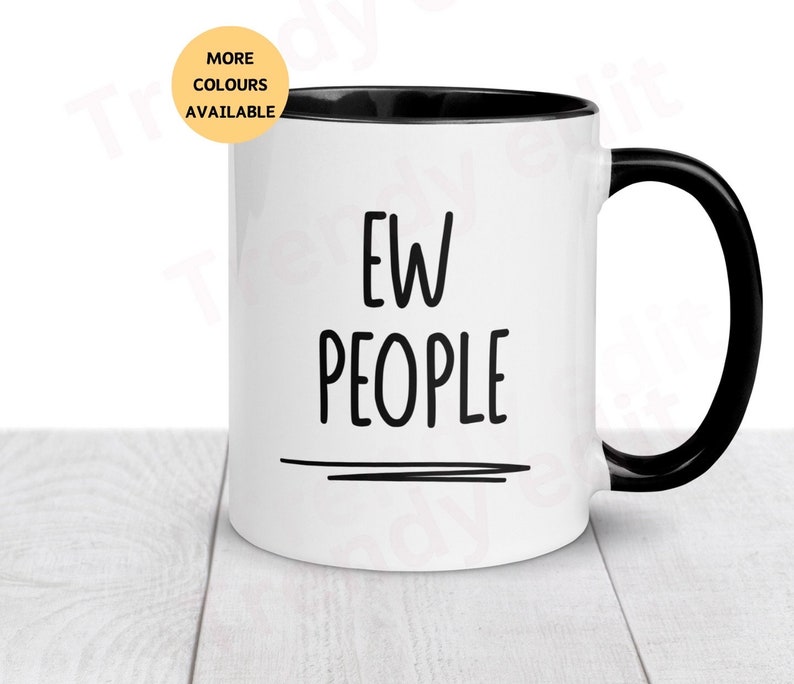 May include: White ceramic mug with a black rim and handle. The mug has the text "EW PEOPLE" printed in black on the front.