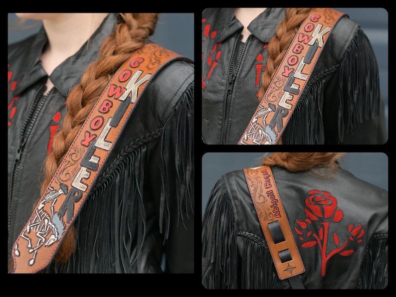 May include: A brown leather guitar strap with the words "Cowboy Killer" embroidered in red and black. The strap has a fringe design and is decorated with a skull and crossbones.