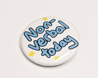 May include: A white button with a blue inscription that reads "Non-Verbal today" and yellow stars around the text.
