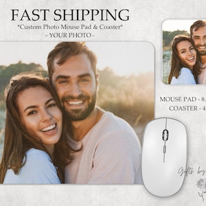 May include: A personalized mouse pad and coaster set featuring a couple smiling at the camera. The mouse pad is 8.75 inches by 7 inches and the coaster is 4 inches by 4 inches. The text "Gifts by PMC" is printed on the mouse pad.