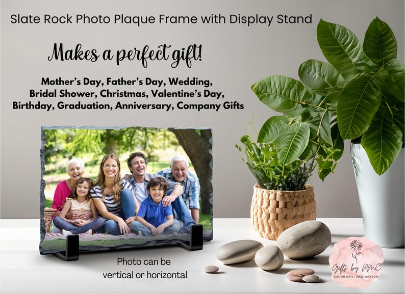 May include: Slate photo plaque frame with a stand, featuring a family photo. The frame is made of natural slate rock and has a rustic look. The photo can be displayed vertically or horizontally. The frame is perfect for displaying photos of loved ones, special events, or memories.