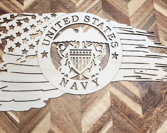 May include: A wooden cutout of a distressed American flag with the United States Navy seal in the centre. The seal features an eagle with a shield and the words "United States Navy".