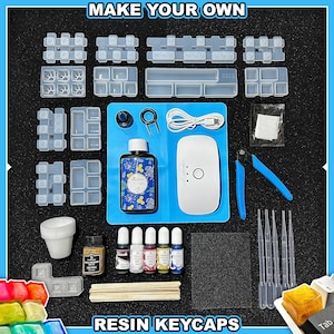 May include: A resin keycap making kit with various moulds, UV resin, colour pigments, and tools. The kit includes a UV lamp, blue cutting pliers, and a blue silicone mat. The text "MAKE YOUR OWN" and "RESIN KEYCAPS" are displayed.