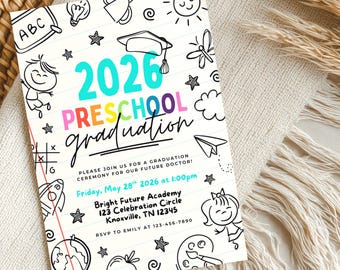 May include: A preschool graduation announcement with the text "2026 Preschool Graduation" in colorful lettering. The invitation features hand-drawn illustrations of school-related items and is set against a neutral background with decorative elements.