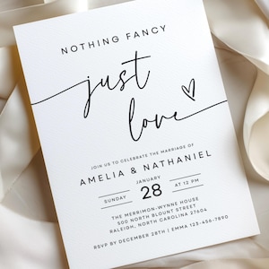 May include: A white wedding invitation card with black text reading NOTHING FANCY just love, followed by JOIN US TO CELEBRATE THE MARRIAGE OF AMELIA & NATHANIEL, SUNDAY JANUARY 28 AT 12 PM, THE MERRIMON-WYNNE HOUSE, 500 NORTH BLOUNT STREET, RALEIGH, NC.