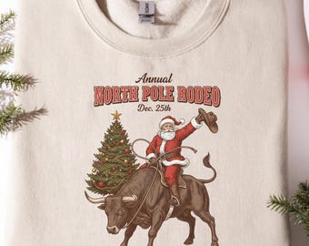 North Pole Rodeo Christmas Sweatshirt – Western Cowboy Santa Holiday Crewneck for Country Lovers