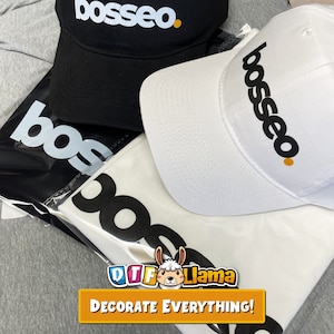 May include: A black baseball cap and a white baseball cap, both with the word "bosseo" printed in black and a small orange dot. A white t-shirt and a black bag with the word "bos" printed in white are also visible. The image includes the text "DECORATE EVERYTHING!"