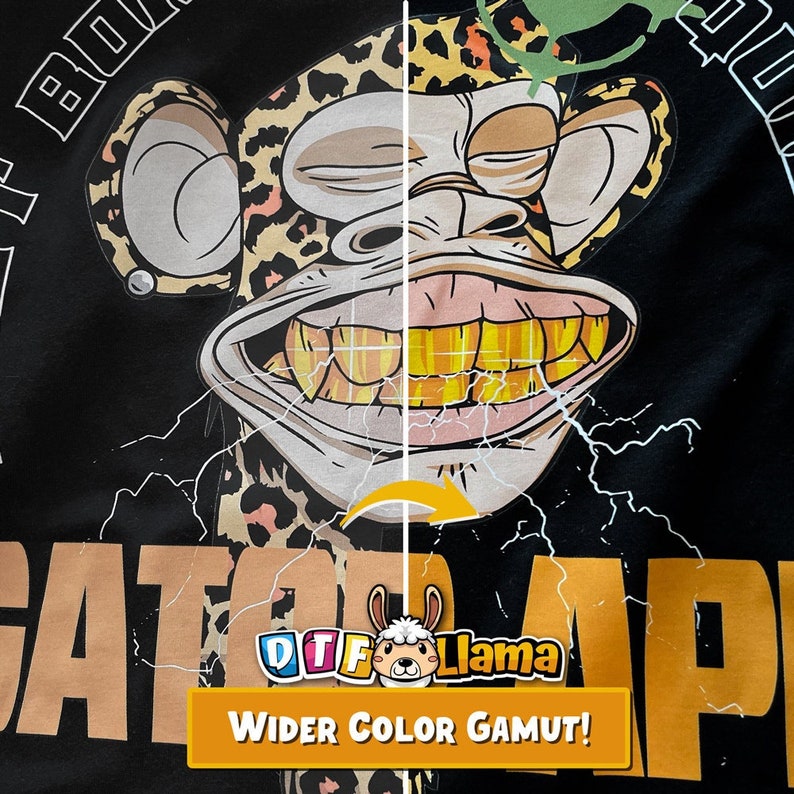 May include: Black t-shirt featuring a cartoon monkey with a leopard print design and gold teeth. The monkey has a wide grin and is surrounded by lightning bolts. The text "GATOR APE" is printed in a tan color, and the phrase "WIDER COLOR GAMUT!" is displayed in a yellow banner.