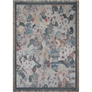 May include: A rectangular woven throw blanket featuring a repeating pattern of pagodas, cherry blossoms, and geometric shapes in muted tones of blue, pink, and beige. The blanket has a dark grey border and a fringed edge on all four sides.