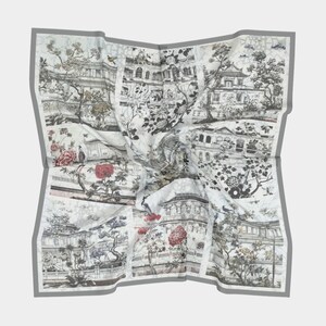 May include: A white silk scarf with a gray border and a repeating pattern of black and white illustrations of Chinese architecture, trees, and birds. The illustrations are in a traditional Chinese style.