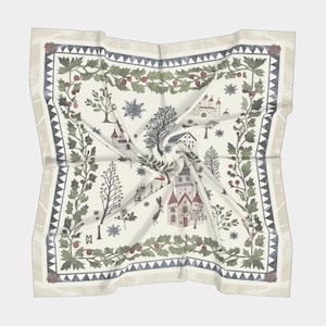 May include: A white silk scarf with a winter village scene. The design features a church, houses, trees, and snowflakes. The border is a green and red holly pattern.